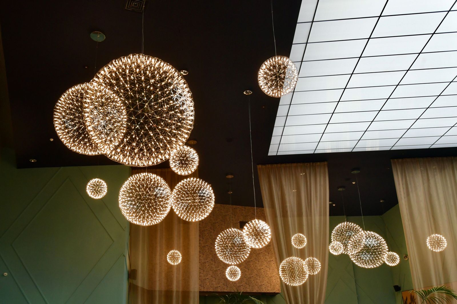 Starburst sphere pendants of various sizes
