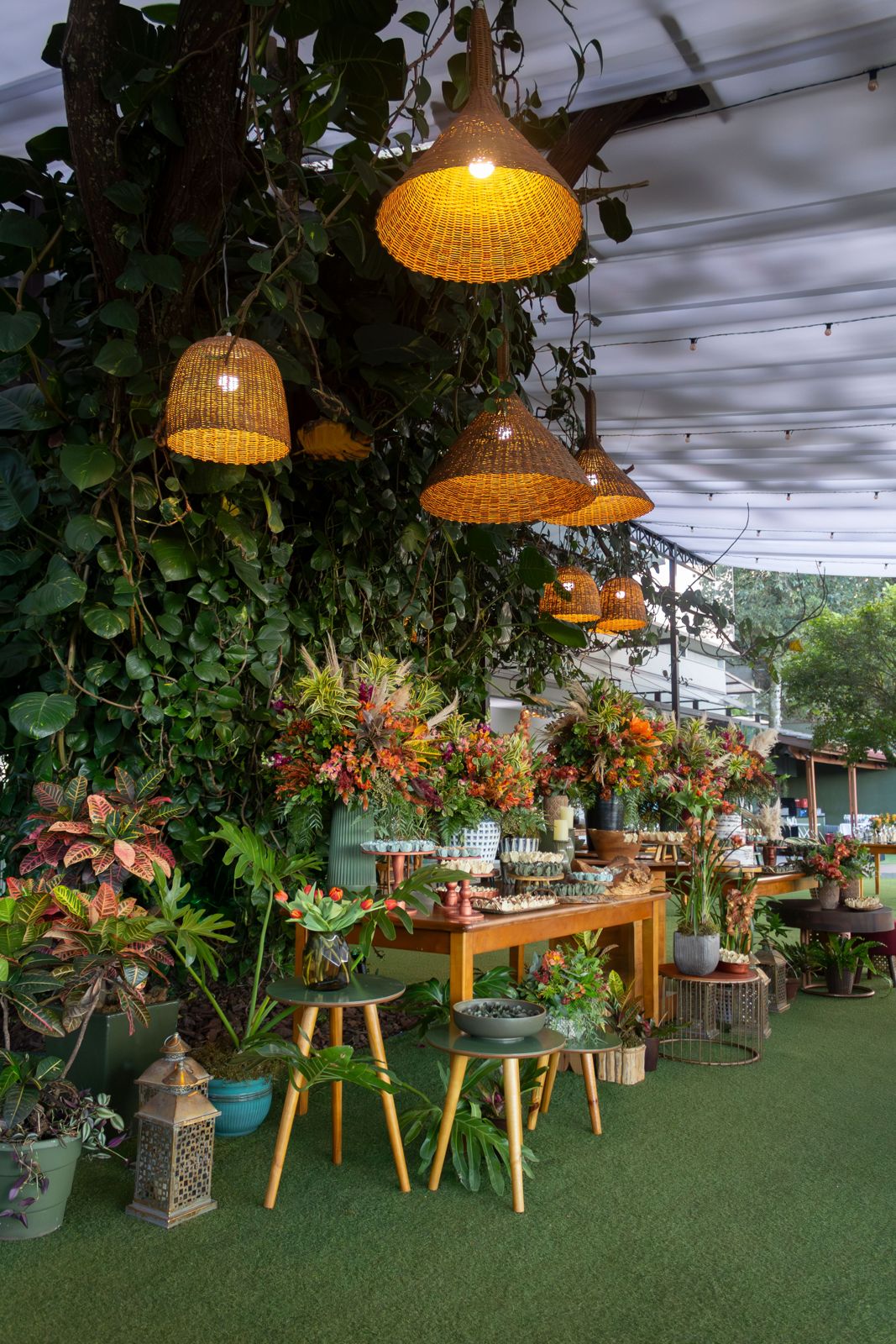 Woven pendant shades lighting a garden event table